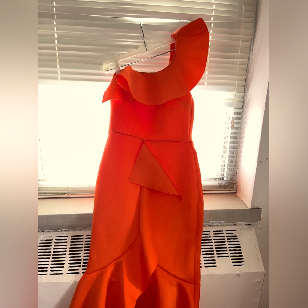 Bright orange, one sleeve dress.